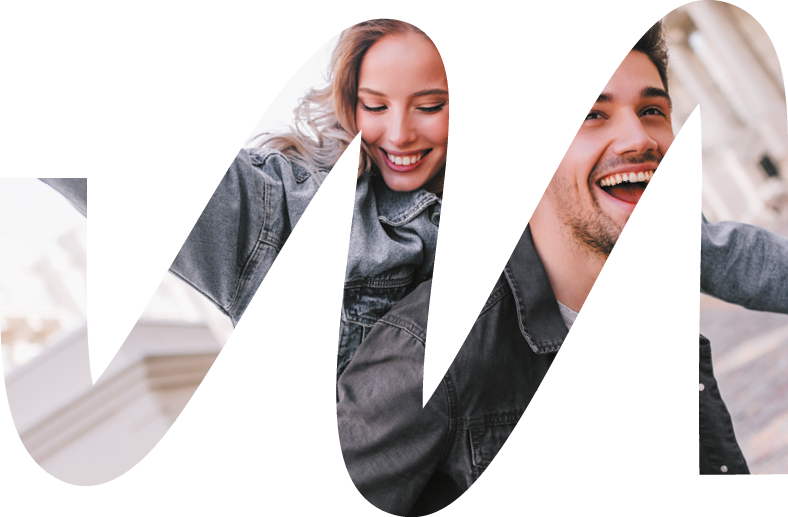 Excited man in black denim jacket chilling with girlfriend  Outdoor photo of happy couple exploring city 