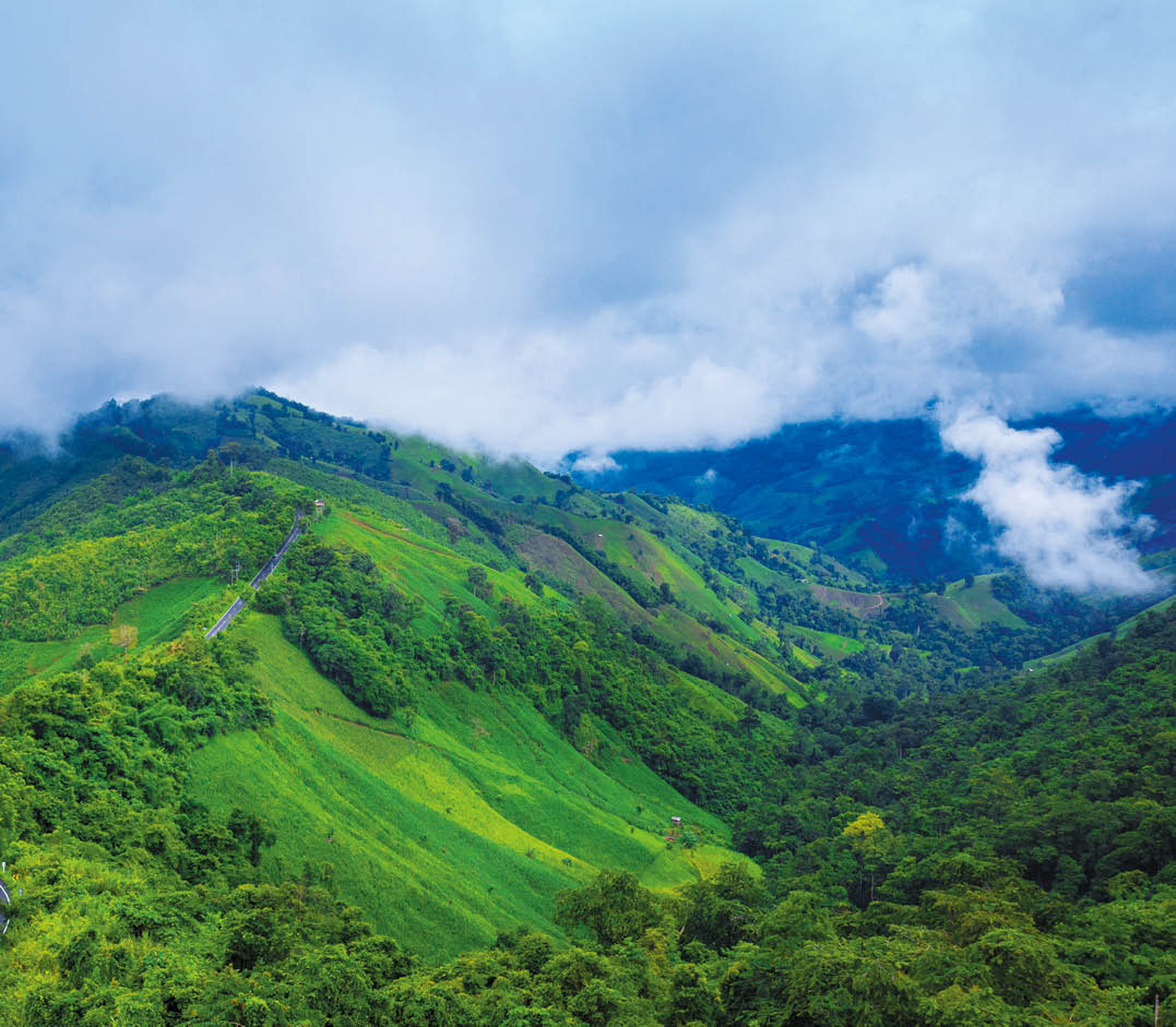 Aerial view of Beautiful sky road over top of mountains with green jungle in Nan province, Thailand 