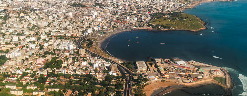 Aerial view of the city of Dakar, Senegal, showing the densely packed buildings and a highway