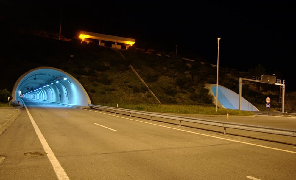 Empty road and tunnel at night time