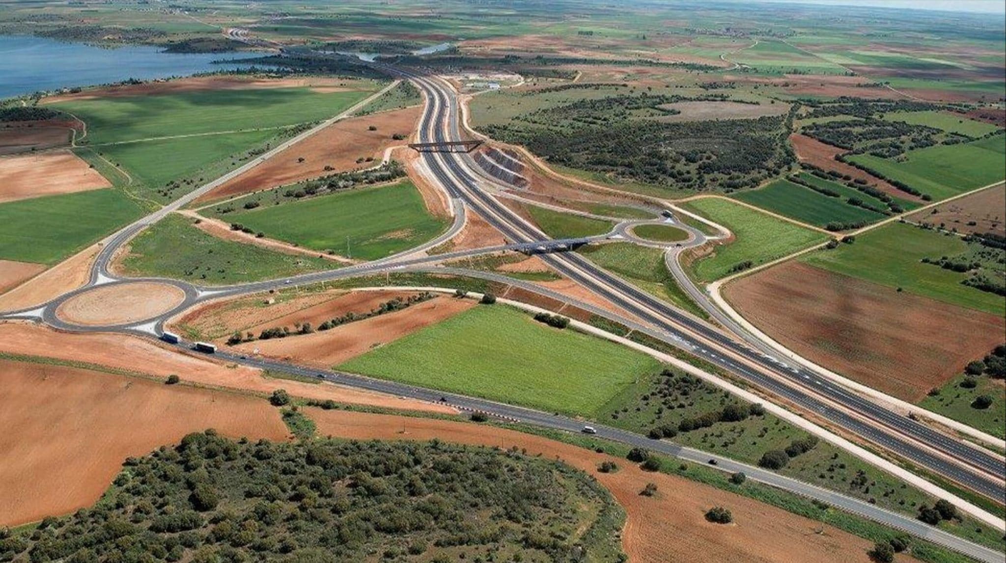 Aerial view of motorway intersecting countryside