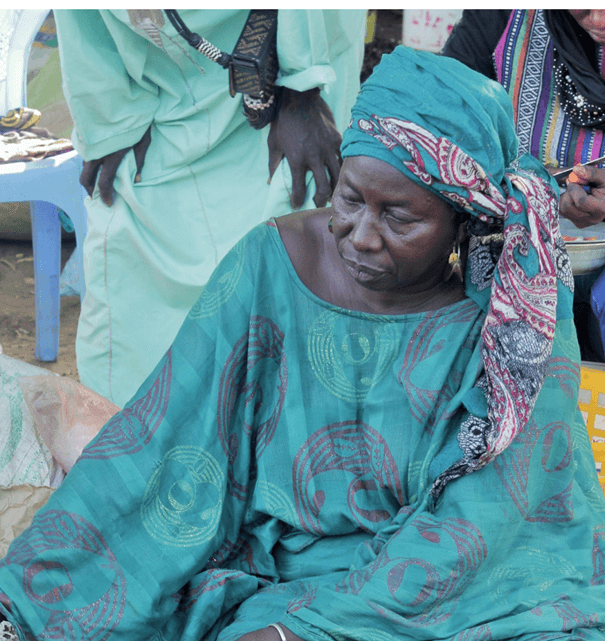 Senegalese woman looking at the ground