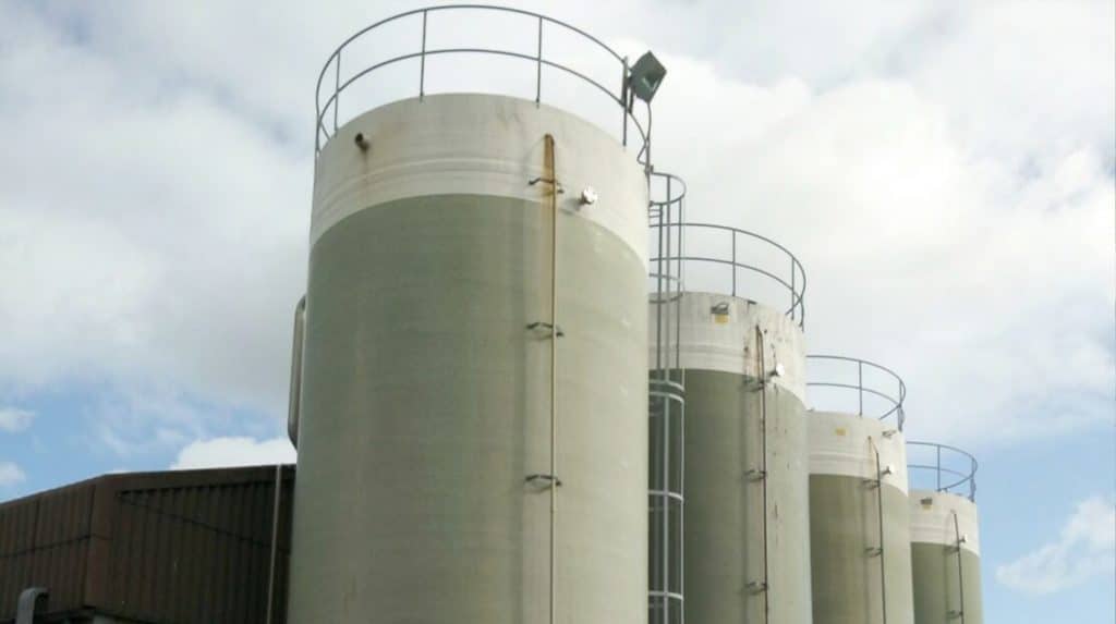 Biogas cylinders against a blue sky