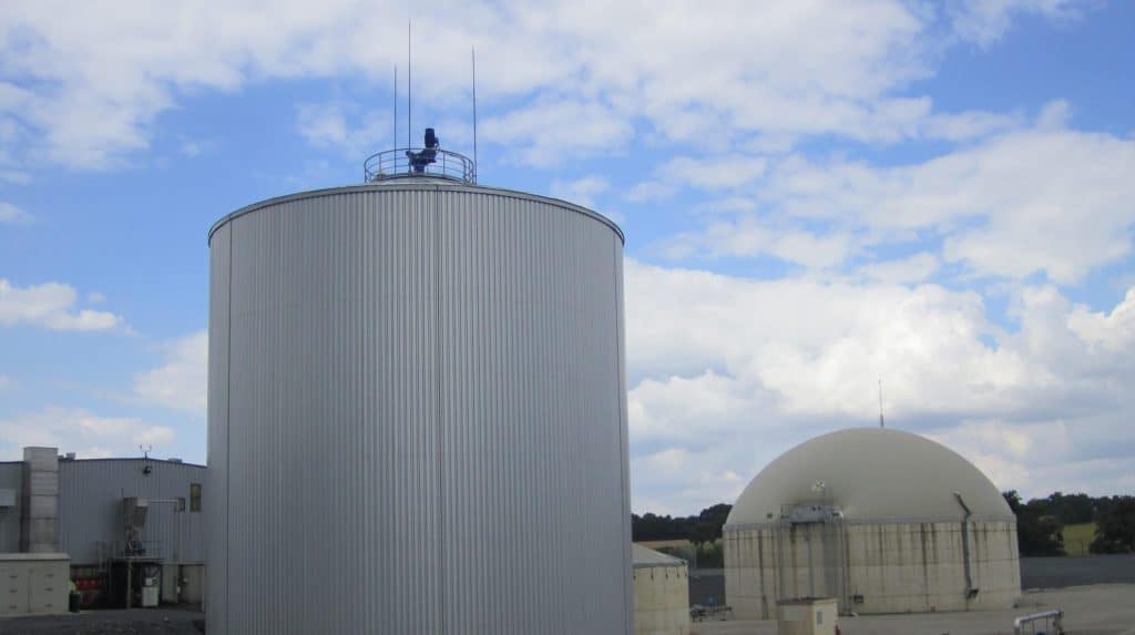 Silver biogas chamber next to spherical dome