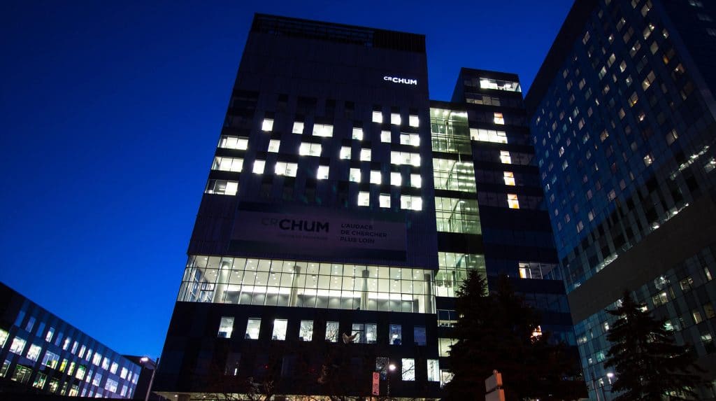Exterior shot of Montreal University Hospital Research Center at night